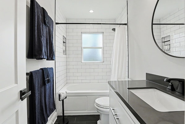 Shower, hair dryer, towels, soap