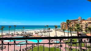 A resort with a beach, pool area, and a view of the ocean. - Comfy & Updated 4th Floor Condo Princesa E-401 (Puerto Peñasco)