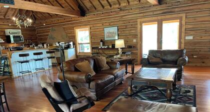 Beautiful Log Home with Fireplace and Deck on 160 acres. Pet friendly