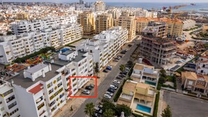 A residential area with multi-story buildings, a playground, and a swimming pool. - House Feliz by Centralgarve (Loulé)