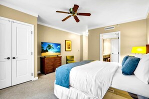 A hotel room with a bed, a ceiling fan, a TV, a desk, and a chair. - Honua Kai 4 Free Cars KBM Resorts Front Alii Suite 4 Units, 8 Bedrooms HK Ml-3167 (Kaanapali)