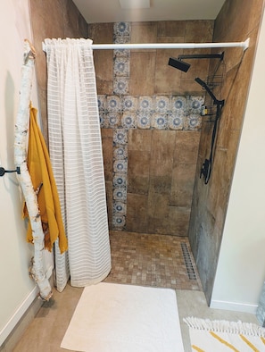 Shower, hair dryer, towels, soap