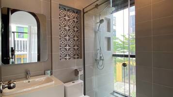 Shower, designer toiletries, hair dryer, towels