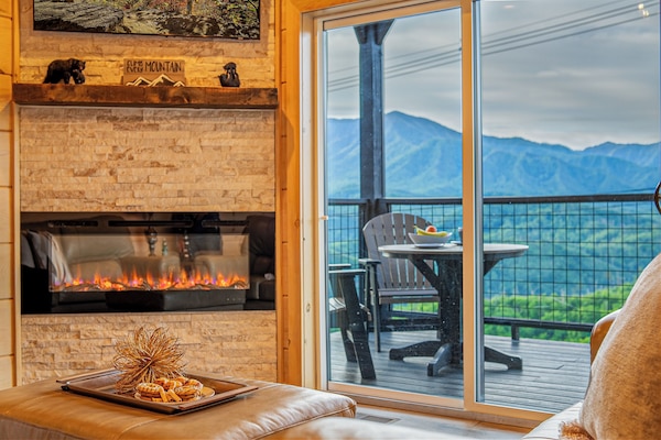 Panoramic Smoky Mountain views right from the living room enjoying the fireplace
