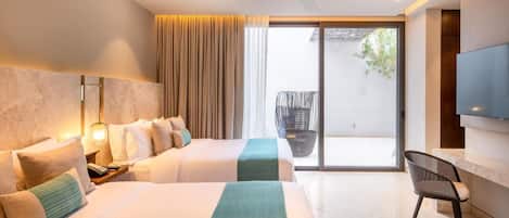 A modern hotel room with two beds, a flat-screen TV, a ceiling fan, and a balcony with a wicker chair.