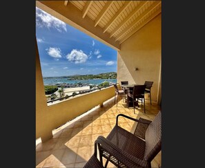 Outdoor dining - Spacious 2BR Retreat • Balcony Views + Parking (Red Hook)