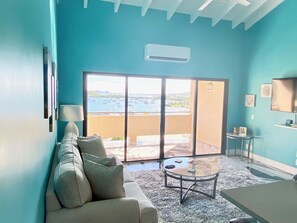 TV - Spacious 2BR Retreat • Balcony Views + Parking (Red Hook)