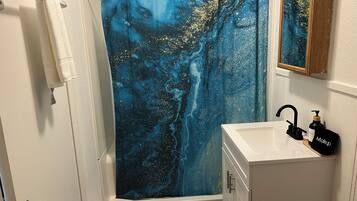 Shower, towels, soap, toilet paper