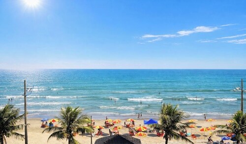 Beachfront apartment with pool for families, pets allowed.