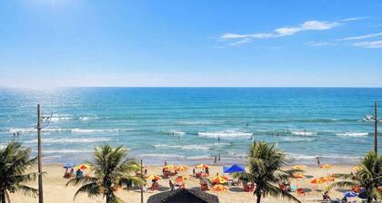 Beachfront apartment with pool for families, pets allowed.