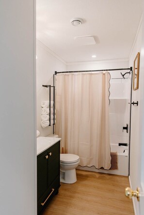 Shower, hair dryer, towels, shampoo