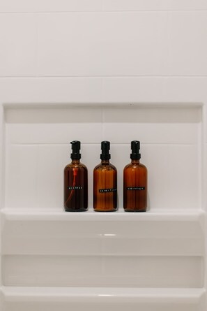 Shower, hair dryer, towels, shampoo