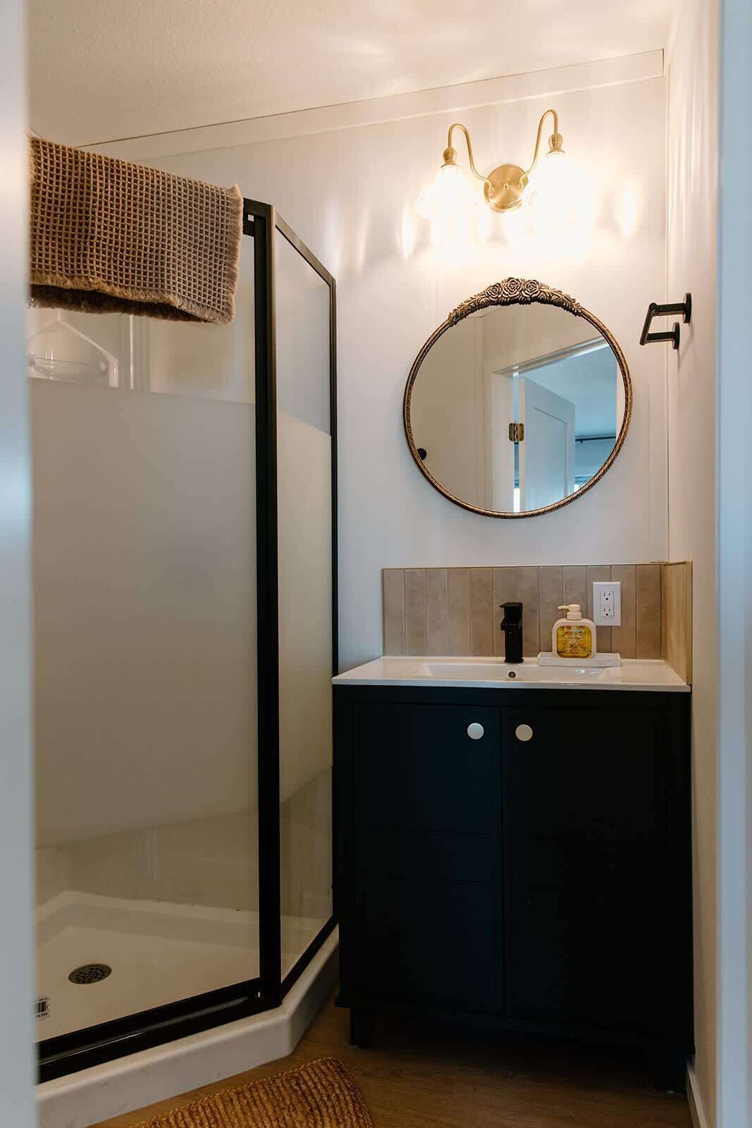 Shower, hair dryer, towels, shampoo