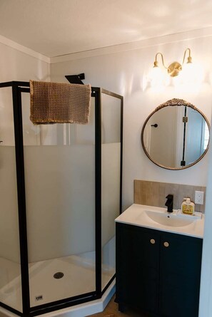 Shower, hair dryer, towels, shampoo