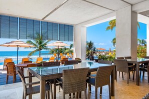 Outdoor dining - Beachfront 4th-floor condo with views, outdoor pool, balcony, W/D & central AC (Nuevo Vallarta)