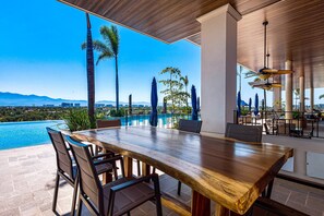 Outdoor dining - Peaceful modern condo with rooftop pool,  washer-dryer and fitness room (Nuevo Vallarta)