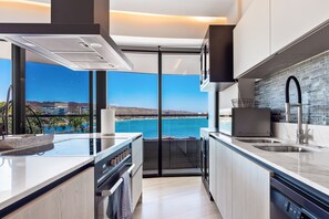 Fridge, microwave, oven, stovetop - 3rd-floor beachfront condo with ocean views, balcony, outdoor pool, gym, & AC (Cruz de Huanacaxtle)