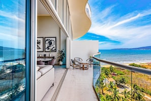Outdoor dining - Luxury ocean-view condo with resort pool, private balcony, and washer/dryer (Nuevo Vallarta)