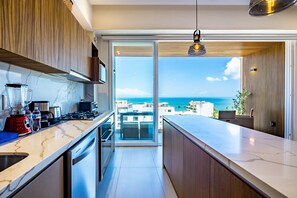 Fridge, microwave, oven, stovetop - Modern waterfront condo with shared pool, balcony, and washer/dryer (Bucerias)