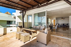 Outdoor dining - Ocean-view penthouse with private pool & terrace, resort pool (Nuevo Vallarta)