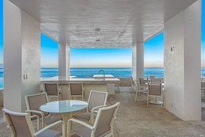 Outdoor dining - Oceanfront studio with private balcony, rooftop infinity pool & gym (Puerto Vallarta)