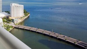 A coastal cityscape with a bridge, buildings, and a clear sky. - erfront 2BR Icon Brickell, 5-Star W Hotel Serenity Views - Wow! (Miami)
