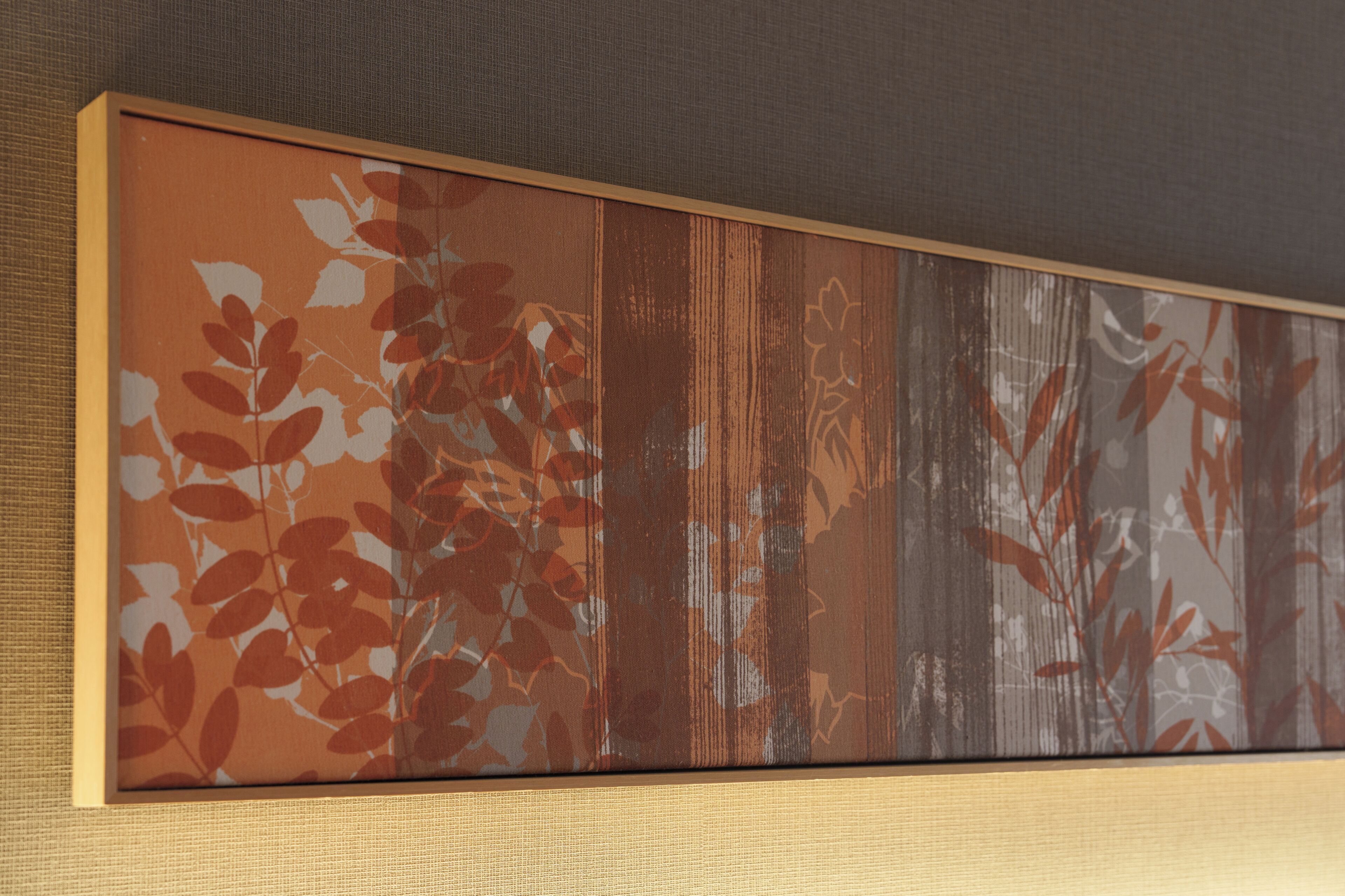 A framed artwork with a nature-inspired design.