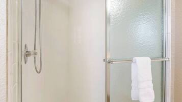 Shower, hair dryer, towels, shampoo