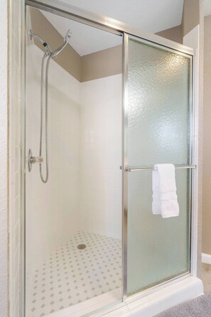 Shower, hair dryer, towels, shampoo