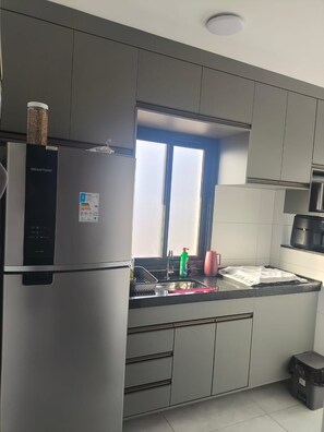 Fridge, microwave, oven, stovetop - Comfortable apartment across from the beach. (Praia Grande)