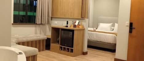 Deluxe Room | Down duvets, in-room safe, individually furnished, blackout curtains