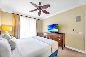 A hotel room with a bed, a television, a ceiling fan, and a window with curtains. - 2 Honua Kai Villas | Ocean Front | Sleeps 14 | Free Car w/ 6+ Nights | ML-3185 (Lahaina)