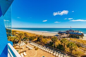A beachside hotel with a pool area, beach access, and a view of the ocean. - Yachtsman S505 1 BR (Myrtle Beach)