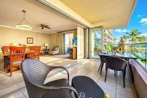 A balcony with a dining area, a ceiling fan, and a view of the ocean. - 3 Honua Kai Villas | Ocean Front | Sleeps 20 | Free Car w/ 6+ Nights | ML-3215 (Lahaina)
