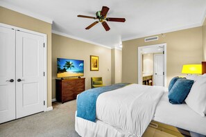A hotel room with a bed, a ceiling fan, a TV, a desk, and a bathroom. - 3 Honua Kai Villas | Ocean Front | Sleeps 20 | Free Car w/ 6+ Nights | ML-3215 (Lahaina)