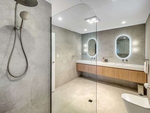 Shower, hair dryer, towels, shampoo