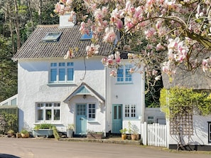 A white house with a tiled roof, a blue door, and multiple windows. - Little Stoke, Porlock (Porlock)