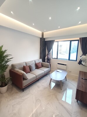 Living area - Marble Palace 1 Bedroom Apartment in BGC (Taguig)