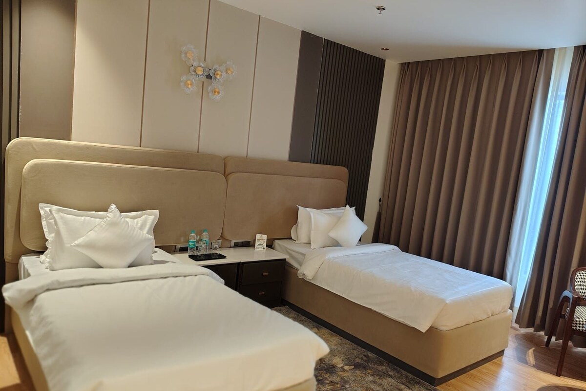 Twin Room | Bathroom | Shower, hair dryer, towels, soap