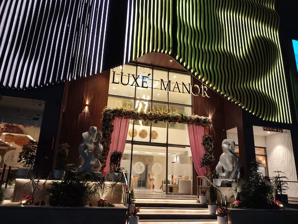 A building with a sign reading 'LUXE MANOR' and a large entrance with steps. - Luxe Manor (Kharar)