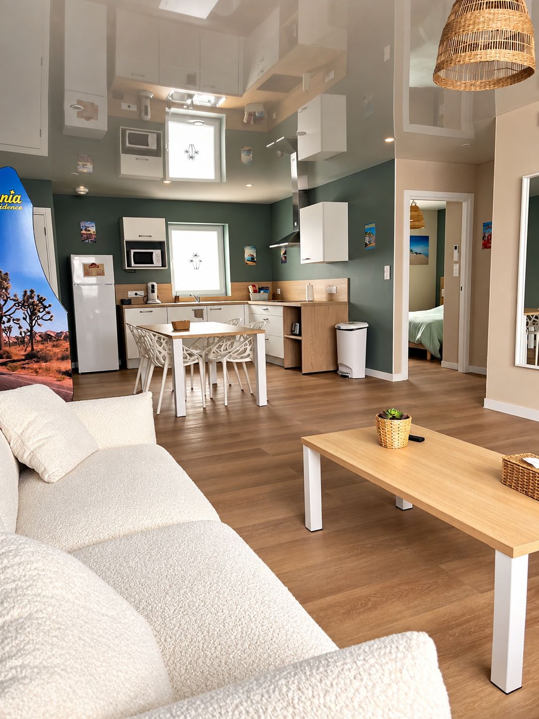 A modern living room with a sofa, a wooden coffee table, and a dining area with chairs.
