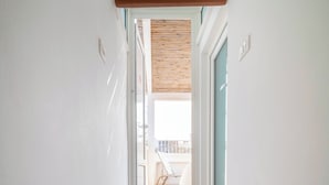 A staircase leading to an outdoor balcony with a view. - Le Contrade Vico Alba (Monopoli)
