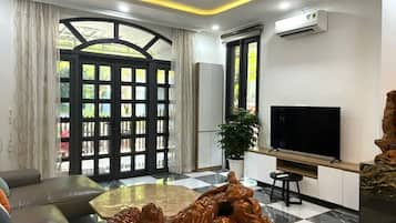 Villa, City View | Living area | 43-inch flat-screen TV with cable channels