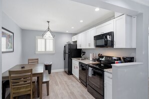 Private kitchen - Spacious 8BR Frenchmen Street stay with pool, hot tub, parking, and easy access to the French Quarter and live music. (New Orleans)