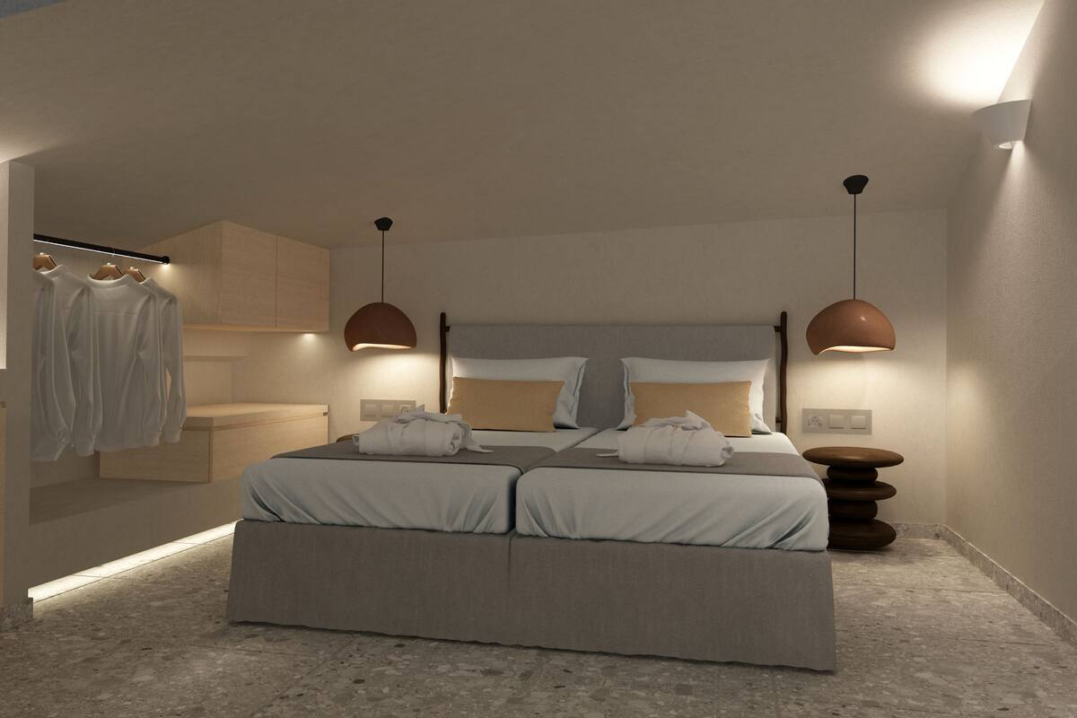 A modern bedroom with a large bed, two pendant lights, a bedside table, and a built-in wardrobe.