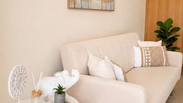 Two Bedroom Apartment Pool View | Living area | 24-inch TV with cable channels