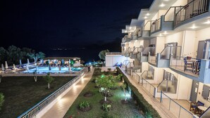 A hotel with multiple balconies, a swimming pool, and a well-maintained garden area. - Cliff Bay Hotel by GHH (Aktio-Vonitsa)