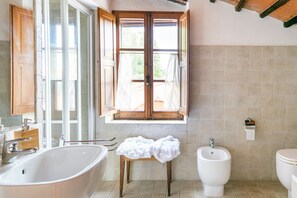 Shower, free toiletries, hair dryer, slippers