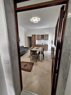 Departamento Confort, balcón | Área de sala de estar