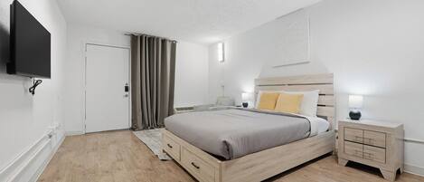 1 bedroom, desk, iron/ironing board, travel crib